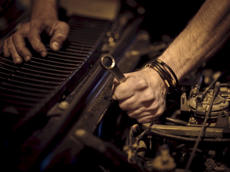 Mechanic working under hood